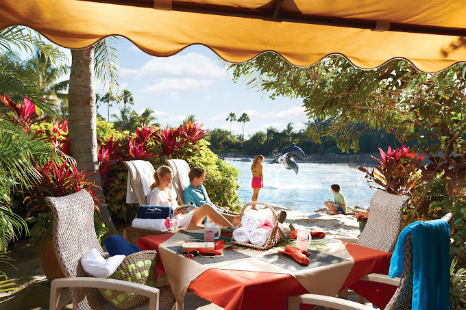 discovery cove cabana with lounge chairs and rolled towels